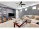 Comfortable living room with media center, couch, and natural light at 9065 Adorable Ave, Las Vegas, NV 89149