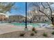 Community pool area with lounge chairs, gazebo, and well-maintained landscaping at 9065 Adorable Ave, Las Vegas, NV 89149