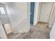 Bright staircase leading to the upper level, featuring a modern railing and neutral carpeting at 9065 Adorable Ave, Las Vegas, NV 89149