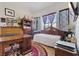 Bedroom space with a day bed, desk, bookshelves and a red and black circular rug at 9096 Nomo St, Las Vegas, NV 89123