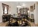 Sophisticated dining room featuring a round table, intricately designed chairs, and a beautiful display cabinet at 9096 Nomo St, Las Vegas, NV 89123