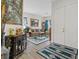 Welcoming foyer that opens into a beautifully furnished living room, complete with elegant decor and ample natural light at 9096 Nomo St, Las Vegas, NV 89123