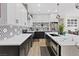 Well-equipped kitchen with white cabinets, granite countertops, and stainless steel appliances at 9096 Nomo St, Las Vegas, NV 89123