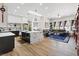 Open-concept kitchen boasts a marble island, modern appliances, and a living area at 9096 Nomo St, Las Vegas, NV 89123