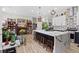 The spacious kitchen offers ample counter space, stainless appliances and barstool seating at 9096 Nomo St, Las Vegas, NV 89123