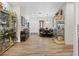 Bright living room with elegant decor, hardwood floors, and display cabinets with collectibles at 9096 Nomo St, Las Vegas, NV 89123