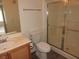 Cozy bathroom featuring a vanity and a shower with glass doors at 9470 Peace Way # 112, Las Vegas, NV 89147