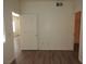 Neutral bedroom with wood-look floors and ample natural light at 9470 Peace Way # 112, Las Vegas, NV 89147