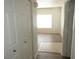 Bright entryway featuring tile transitioning to wood-look flooring and white doors at 9470 Peace Way # 112, Las Vegas, NV 89147
