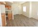 Bright living room with kitchen view and sliding doors to the outside at 9470 Peace Way # 112, Las Vegas, NV 89147