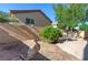 Backyard features a private seating area, rock landscaping, and perimeter block wall for seclusion at 9780 Ziegler Ave, Las Vegas, NV 89148