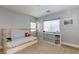 Bright bedroom features a bed with storage underneath, natural light, and shelving for organization at 9780 Ziegler Ave, Las Vegas, NV 89148