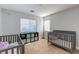 Cozy bedroom with two cribs, storage, and natural light, perfect for a Bedroom or young children at 9780 Ziegler Ave, Las Vegas, NV 89148
