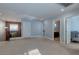 Hallway area leading to various rooms, showcasing neutral walls, lighting fixtures, and carpeted flooring at 9780 Ziegler Ave, Las Vegas, NV 89148
