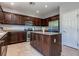 Kitchen features granite countertops, stainless steel appliances, and dark wood cabinets at 9780 Ziegler Ave, Las Vegas, NV 89148