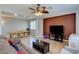 Spacious living room connecting to the dining area, featuring a ceiling fan and ample seating at 9780 Ziegler Ave, Las Vegas, NV 89148