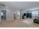 Spacious living area with neutral carpet, multiple doorways, and ample natural light at 9780 Ziegler Ave, Las Vegas, NV 89148