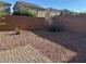 Low maintenance backyard area with red rock and a small brick-paved patio at , Las Vegas, NV 89148