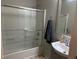 Bathroom with shower-tub combination and vanity with framed mirror at , Las Vegas, NV 89148