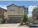 Two-story home featuring desert landscaping and a two-car garage at , Las Vegas, NV 89148