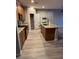 Open kitchen with stainless steel appliances, an island and gray flooring at , Las Vegas, NV 89148