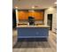 Open kitchen with stainless steel appliances, an island and gray flooring at , Las Vegas, NV 89148