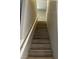 A bright stairway with painted white railing leads to the upper level of the home at , Las Vegas, NV 89148