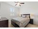 Bedroom featuring carpet flooring, window with blinds, and bedside tables at 10127 Knotty Skye Ave, Las Vegas, NV 89166