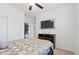 Bright bedroom featuring closet, dresser, and wall-mounted television at 10127 Knotty Skye Ave, Las Vegas, NV 89166