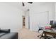 Neutral bedroom featuring a ceiling fan, closet, desk, and chair at 10127 Knotty Skye Ave, Las Vegas, NV 89166