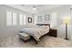 Bedroom with neutral decor, wood-look floors, and plentiful light at 10127 Knotty Skye Ave, Las Vegas, NV 89166
