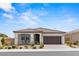 Charming single-story home featuring a well-maintained front yard and a two-car garage at 10127 Knotty Skye Ave, Las Vegas, NV 89166