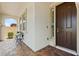 Inviting front porch features elegant stone columns and stylish seating area near the front entrance at 10127 Knotty Skye Ave, Las Vegas, NV 89166