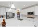 Bright kitchen with a large island, stainless steel appliances, and abundant storage at 10127 Knotty Skye Ave, Las Vegas, NV 89166