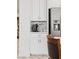 Featuring a beverage station with white cabinets, tile backsplash, and stainless steel refrigerator at 10127 Knotty Skye Ave, Las Vegas, NV 89166