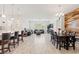 Open-concept living area featuring a modern kitchen, dining area, and comfortable seating at 10127 Knotty Skye Ave, Las Vegas, NV 89166