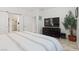 Light and airy main bedroom suite featuring an ensuite bathroom and barn door closet at 10127 Knotty Skye Ave, Las Vegas, NV 89166