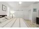 Bright main bedroom with a ceiling fan, modern decor, and light wood floor at 10127 Knotty Skye Ave, Las Vegas, NV 89166