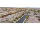 Overhead aerial captures a suburban neighborhood with tidy streets and green spaces, offering a peaceful setting at 10356 Addie De Mar Ln, Las Vegas, NV 89135