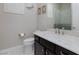 Modern bathroom features granite countertop and large mirror with a shower in view at 10356 Addie De Mar Ln, Las Vegas, NV 89135