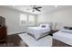 This shared bedroom features 2 beds, hardwood floors, and 2 large windows providing natural light at 10356 Addie De Mar Ln, Las Vegas, NV 89135