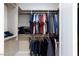Open closet filled with neatly hung and folded clothing in this organized storage space at 10356 Addie De Mar Ln, Las Vegas, NV 89135