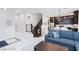 Open living space with stairs, modern decor, and views into a contemporary kitchen at 10356 Addie De Mar Ln, Las Vegas, NV 89135