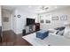Upstairs loft area featuring hardwood floors, comfortable seating, and ample natural light at 10356 Addie De Mar Ln, Las Vegas, NV 89135