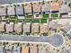 An aerial view showcases beautiful houses with manicured lawns in a quiet residential neighborhood at 10415 Sadie Blake Ave, Las Vegas, NV 89166