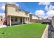 Spacious backyard featuring well maintained lawn, patio, privacy wall, and hot tub at 10415 Sadie Blake Ave, Las Vegas, NV 89166