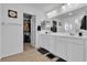 Well-lit bathroom features double sinks and a walk-in closet at 10415 Sadie Blake Ave, Las Vegas, NV 89166