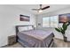 Bright bedroom with ceiling fan, neutral walls, carpeted floor and large double bed at 10415 Sadie Blake Ave, Las Vegas, NV 89166