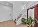 Welcoming entryway with staircase, plant and mirror at 10415 Sadie Blake Ave, Las Vegas, NV 89166