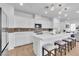 Bright kitchen with white cabinets, quartz countertops, and stainless steel appliances at 10415 Sadie Blake Ave, Las Vegas, NV 89166